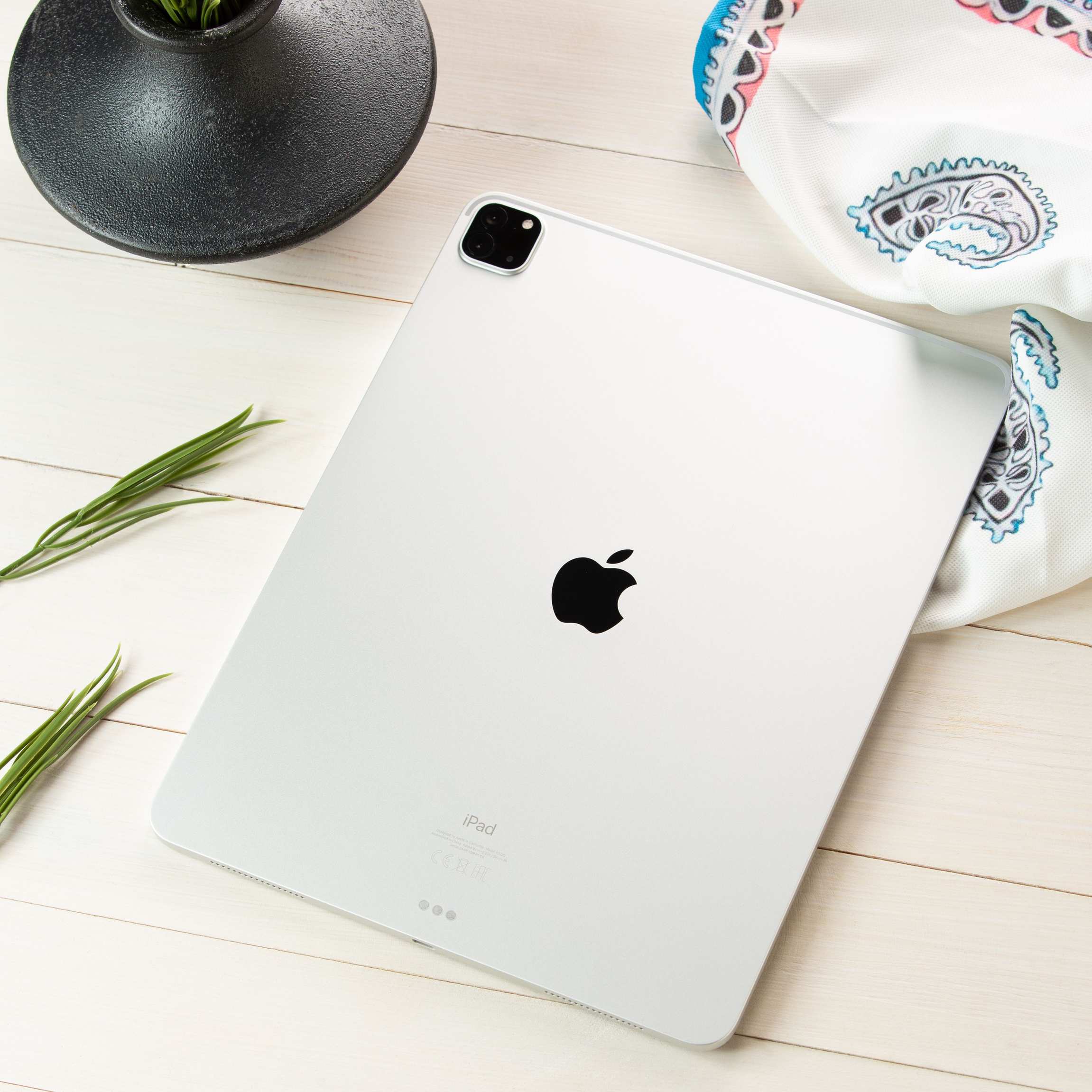 Tablet device displayed on a styled flat lay showcasing modern technology aesthetics
